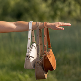 Person holding different color biggie bee bags