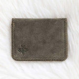 Gray fabric wallet on a white textured surface