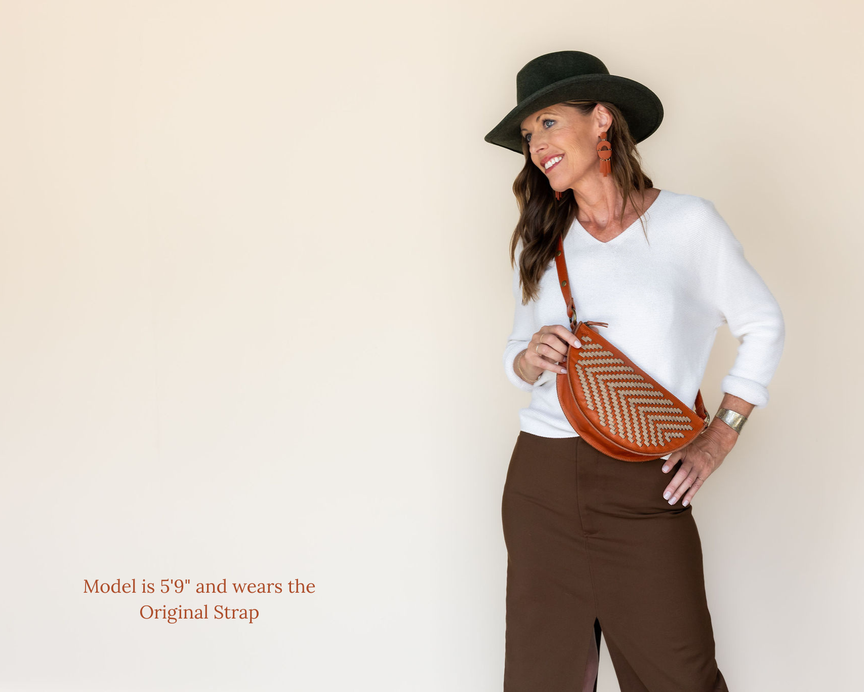 The Woven Terracotta & Seashell Biggie Bee worn across the body