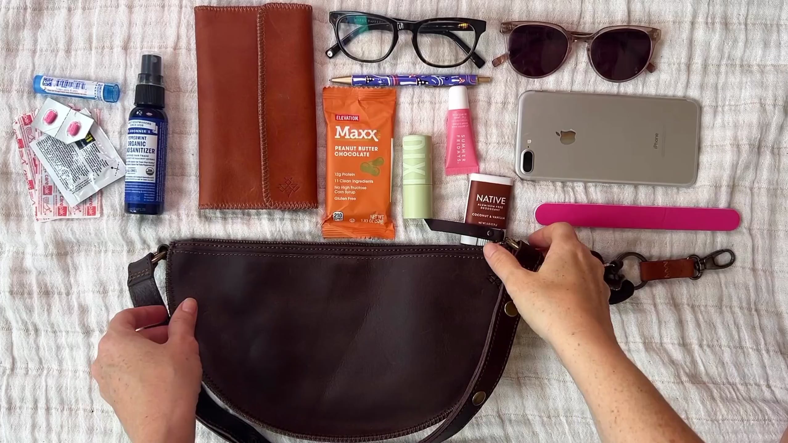 Medium dark brown leather bag packing video