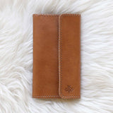 Light brown leather wallet for traveling