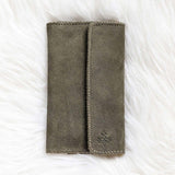 Moss green suede travel wallet, front view